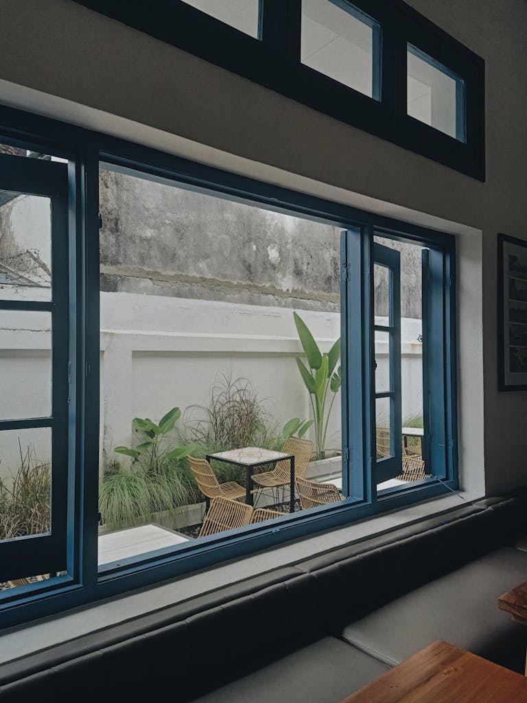 A window with blue glass and a table in front of it